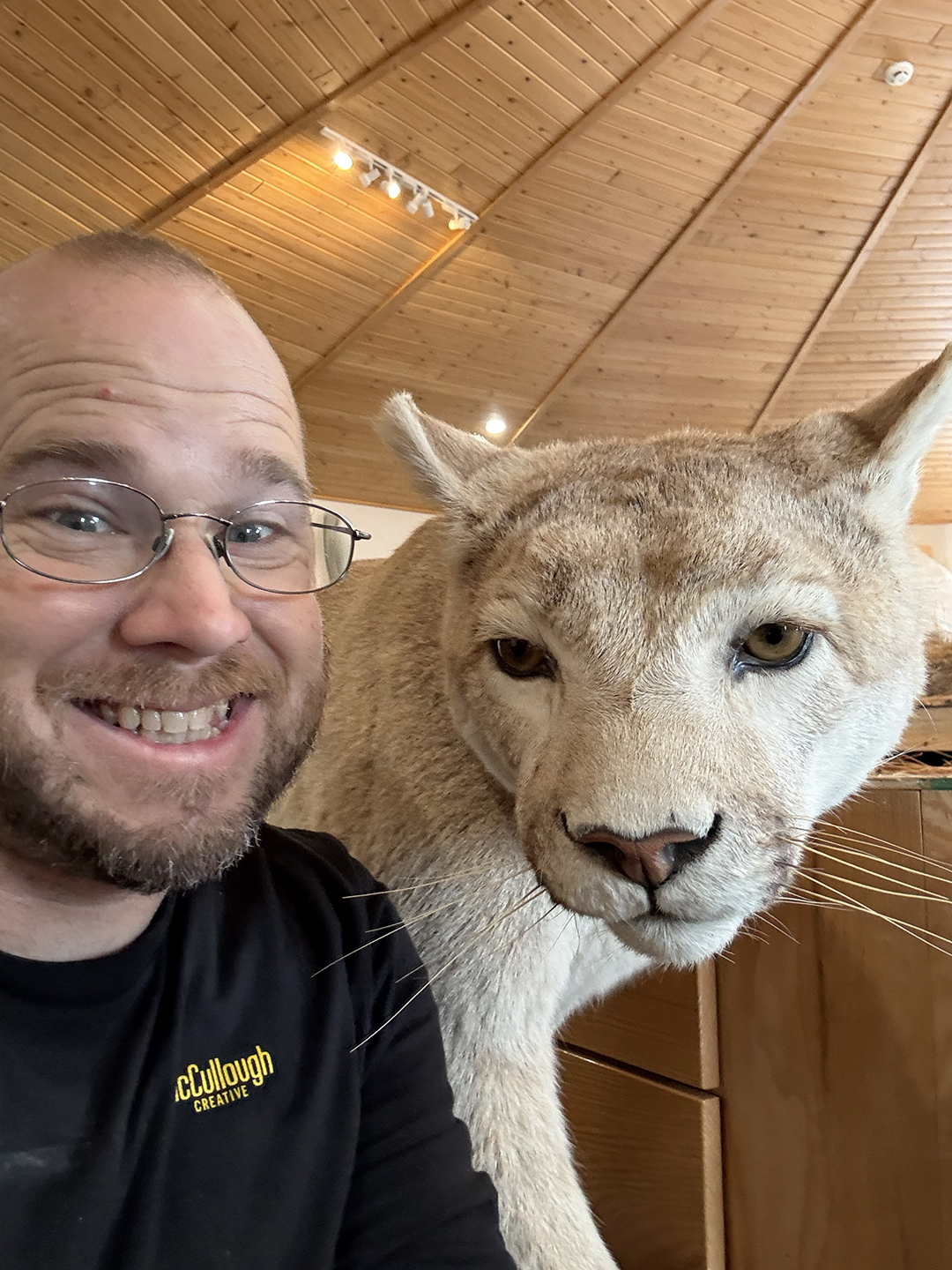 Jeff poses with a new friend at a nature center.